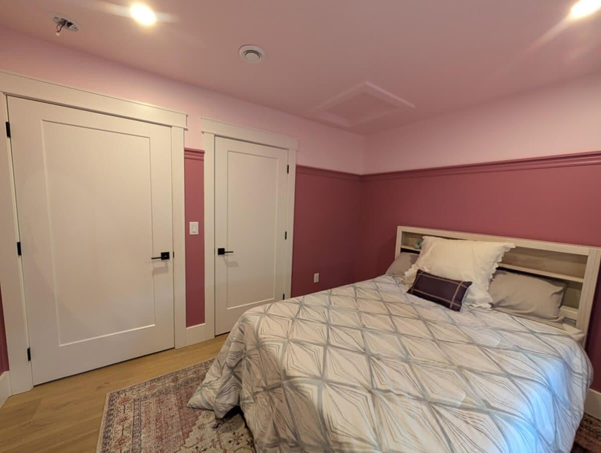 interior paint job and trim finish of pink bedroom