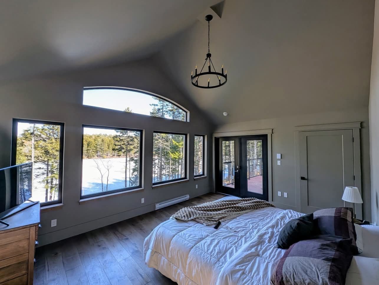 A freshly painting bedroom with high ceilings